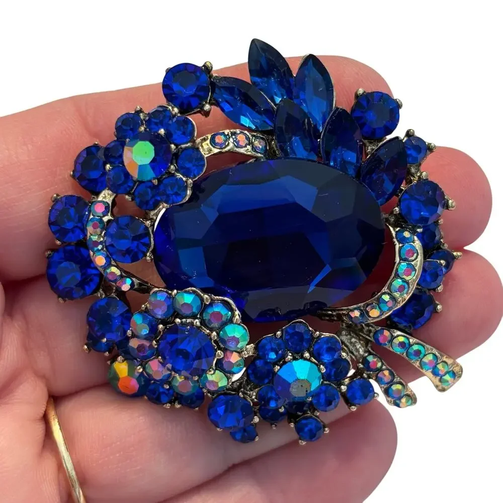 Vintage inspired chunky blue rhinestones brooch ornate silvertone AB finish